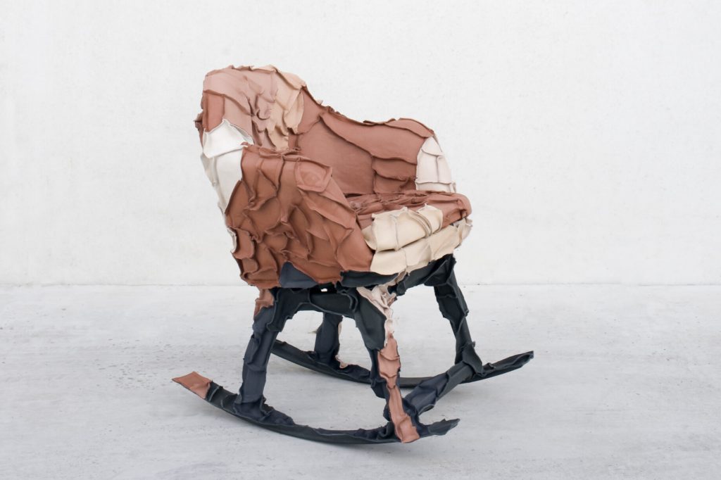 Skin collection chair covered in leather scraps