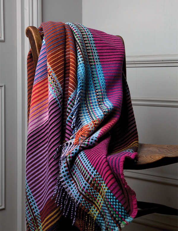 Colourful blanket for a hygge inspired home by Wallace & Sewell