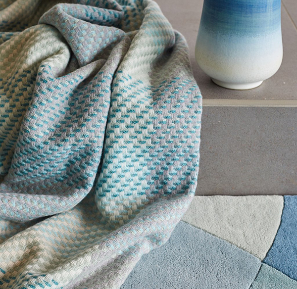 Turquoise blue throw by Claire Gaudion