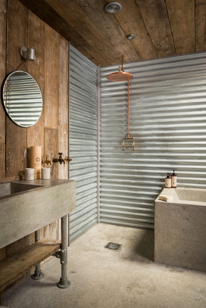 Bathroom area in a cabin built from recycled materials